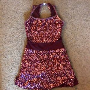 A sparkly dress with rose gold and purple sequins